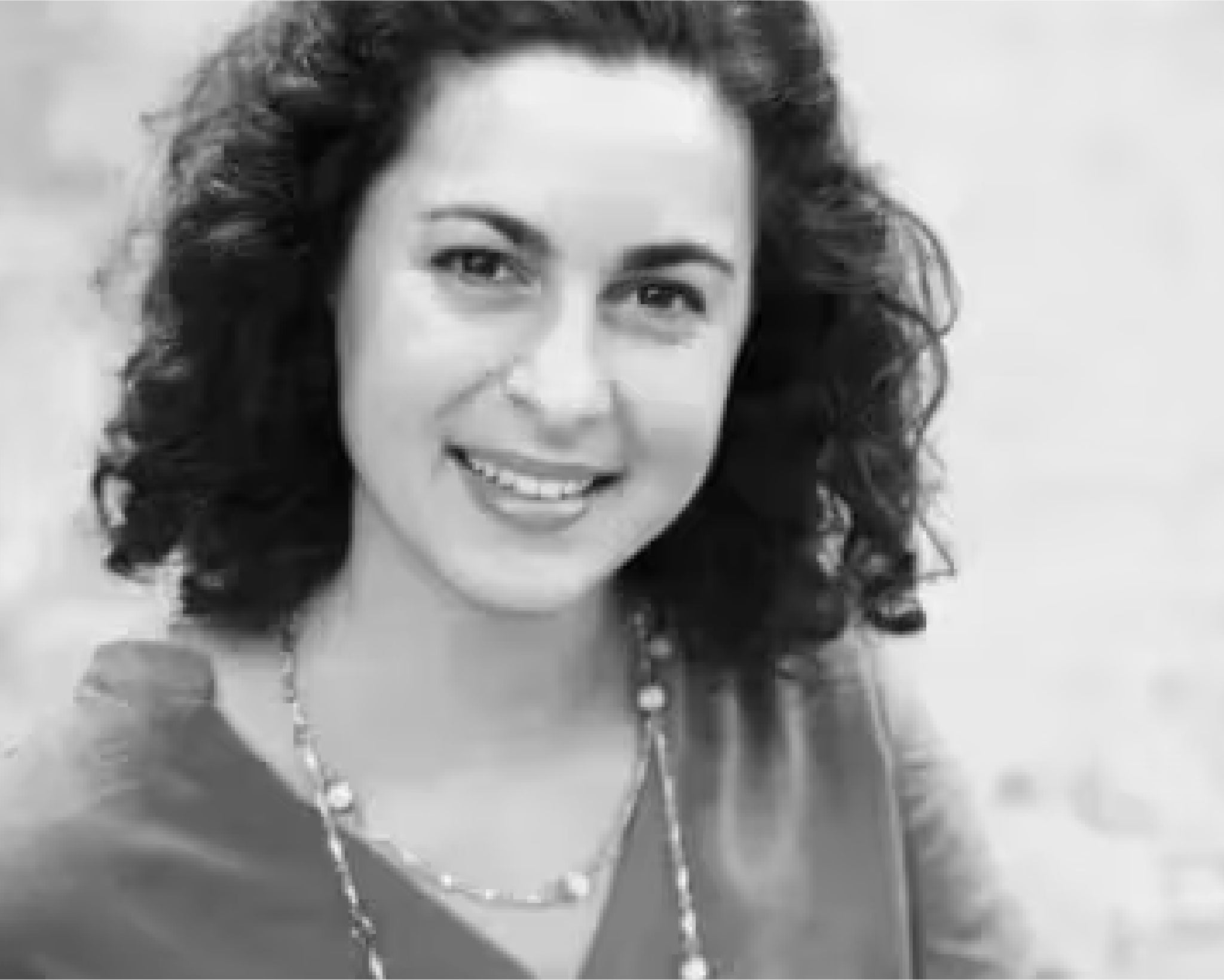 A black-and-white picture of Rose Denicola, smiling into the camera.