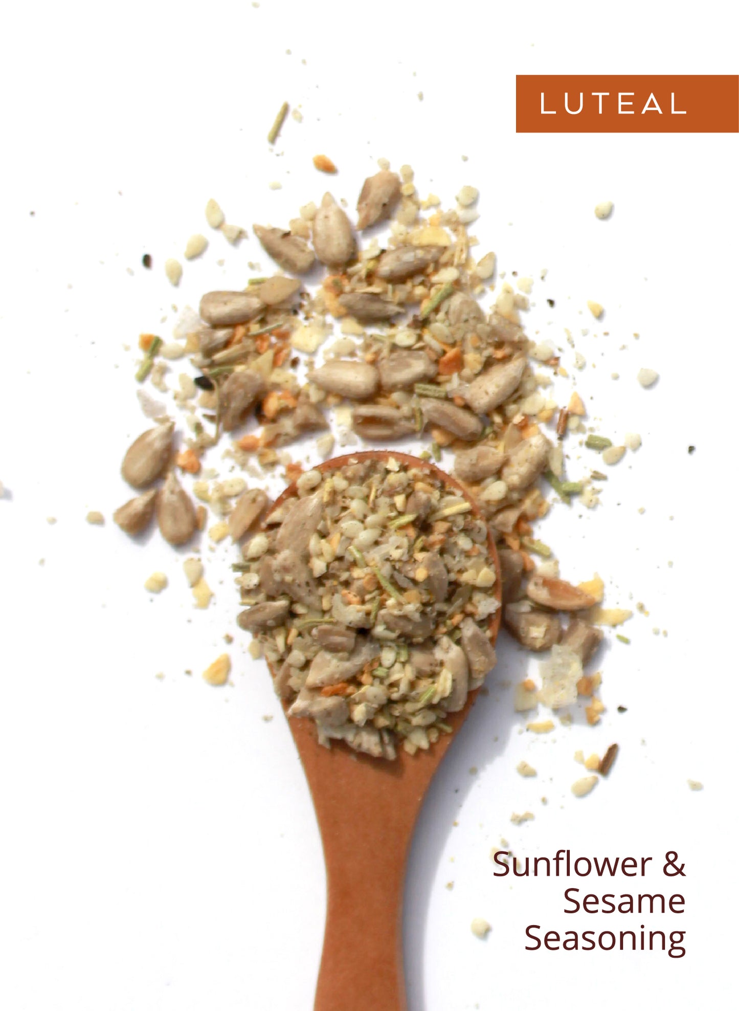 Wooden spoon of Luteal seed blend, labeled “Sunflower & Sesame Seasoning.”